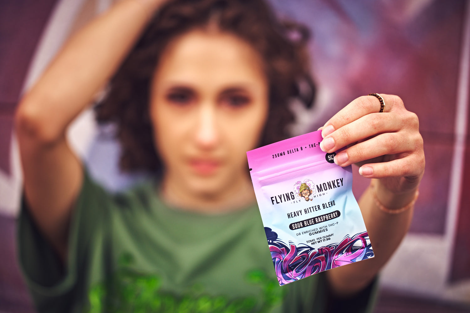 Woman holding Heavy Hitter Gummies